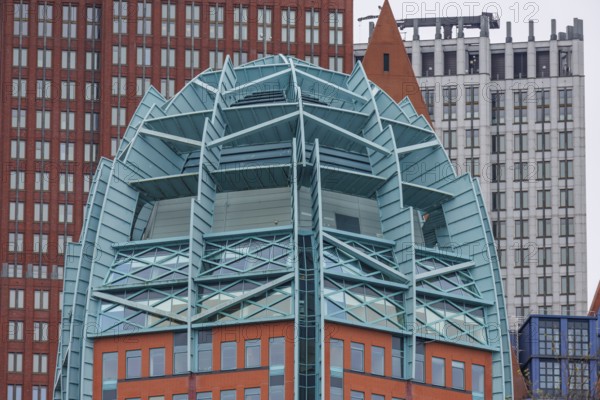 Detailed view of a modern building with a striking architectural design of glass and steel, den