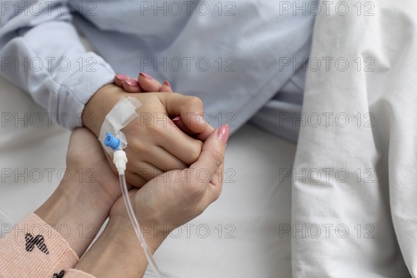 A deeply touching moment of support and emotional connection shared in the comforting atmosphere of