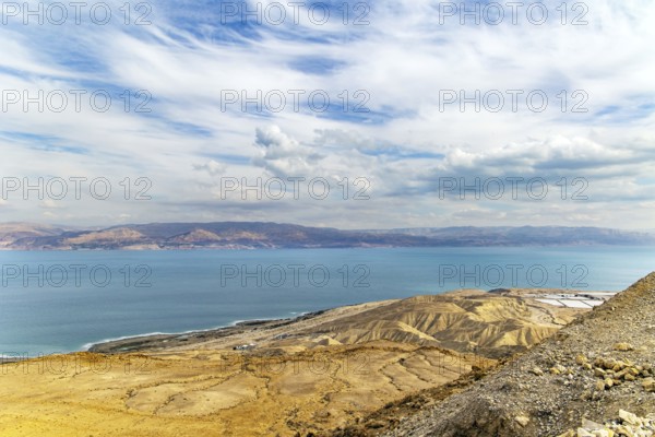 The great wonder of nature is the Dead Sea. The sea surface reflects the clouds. Israeli coast.