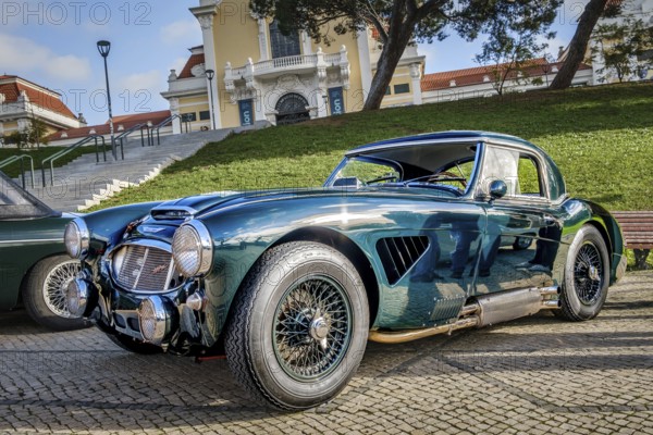 Lisbon, Portugal, Jan 20, 2024: Vintage green Austin Healey 3000 sports car on cobblestone near