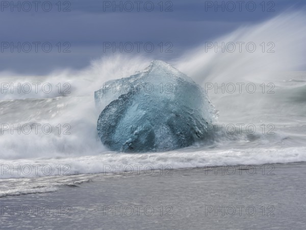Diamond Beach, iceberg in the surf, near Jökulsarlon glacier lagoon, Vatnajökull National Park,