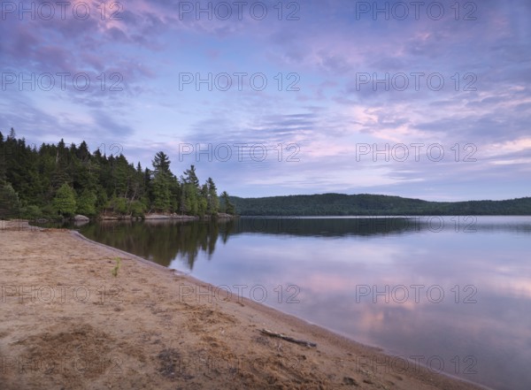 Algonquin Provincial Park summertime nature scenery of the Lake of Two Rivers at sunset. Ontario,