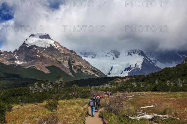 Trekkers at Cascada Martin with a view of the Fitzroy Massif, El Chaltén, Los Glaciares National