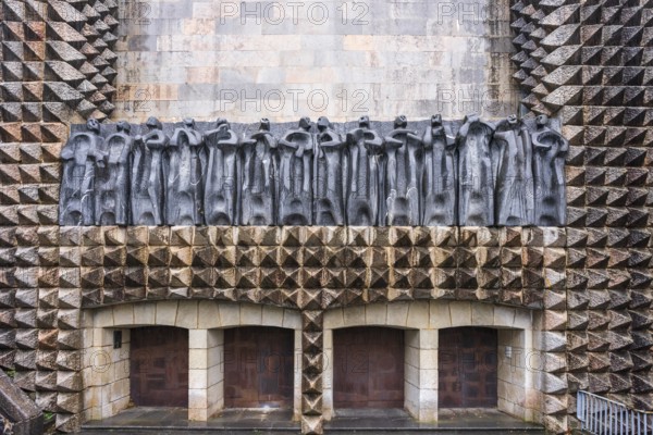 Sculptures of the 14 apostles on the façade, sculptor Jorge Oteiza, and iron doors by Eduardo