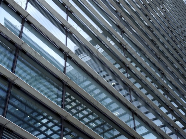 A full frame modern office architecture abstract with geometric shapes and buildings reflected in