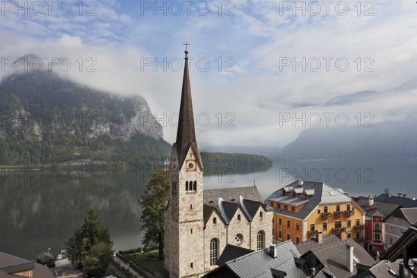 The most picturesque small town in Austria - Hallstatt. Slender belfry and Lutheran church on the