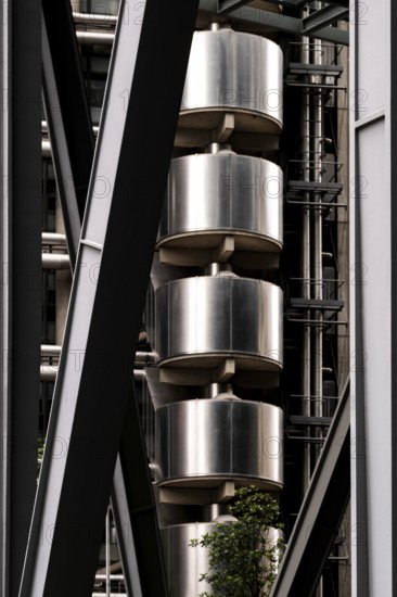 Close-up of an industrial-style building featuring metal structures and vertical elements, London,
