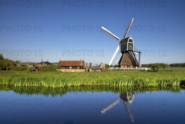 Windmill the Wingerdse Molen close to the Dutch village Bleskensgraaf seen on a clear and crisp day
