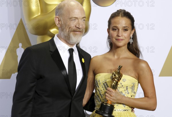 Alicia Vikander and J.K. Simmons at the 88th Annual Academy Awards, Press Room held at the Loews