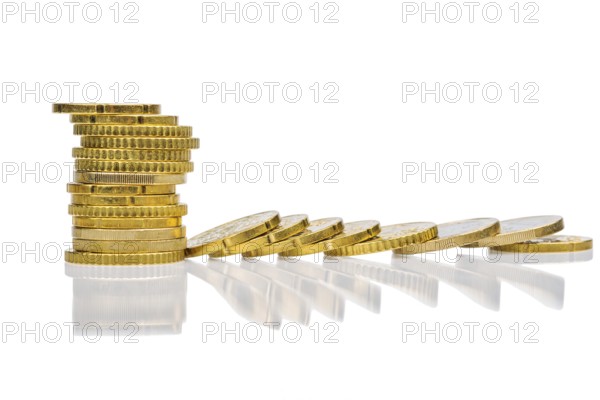 Stacks of coins and lying coins, symbolic photo for mountain of debt, profit collapse and