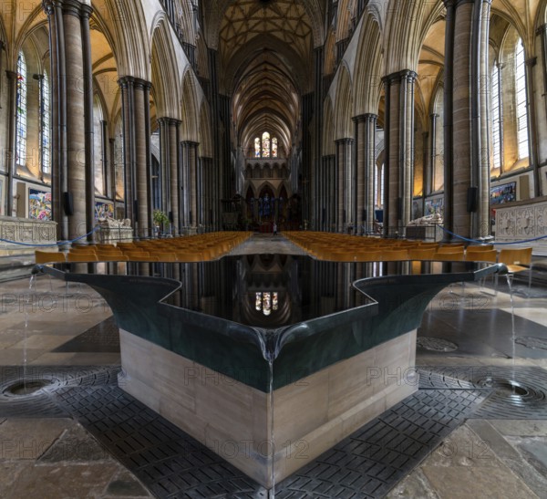 Salisbury, United Kingdom, 8 September, 2022: view of the font by William Pye and the central nave