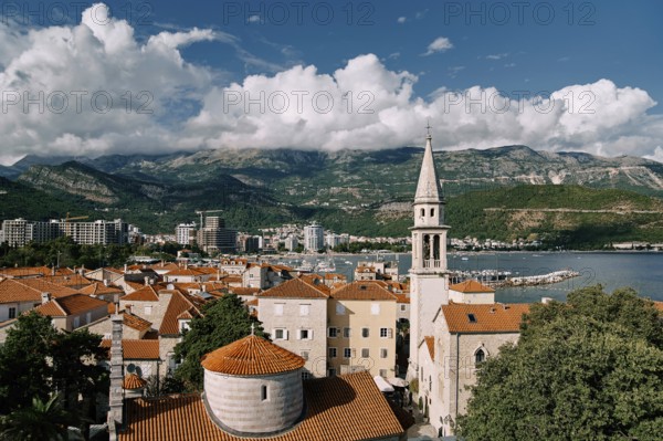 Church of the Holy Trinity near St. John Cathedral among old houses with red roofs. Budva,