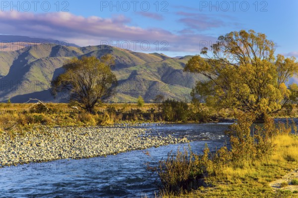 Valley at the foot of the Clay Cliffs and a slow river. Fabulous country of New Zealand. Travel to