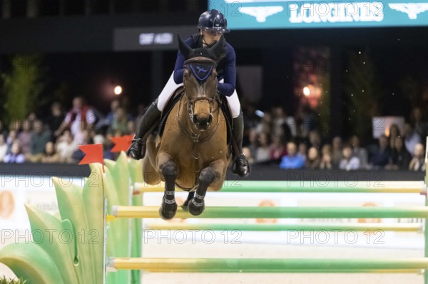 Jessica Burke of Ireland competes in the equestrian Audi Grand Prix at Jumping International
