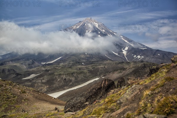 Mountains and volcanoes. Beautiful landscape of Kamchatka Peninsula: summer panoramic view of