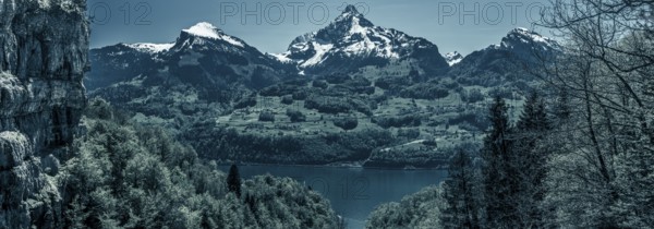 Great panorama over the lake Walensee and its beautiful surroundings, the snowy mountain peaks and