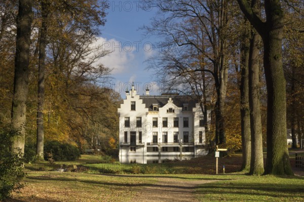 Castle Staverden near Ermelo in the Dutch region Veluwe seen from the surrounding autumn mooded