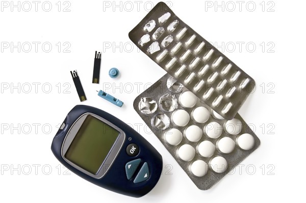 Blue instrument for measuring glucose levels with test strips, needles and pills isolated on white