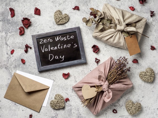 Zero waste Valentine's Day concept. Eco-friendly gift cloth wrapping in Furoshiki style and