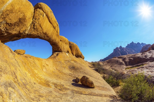 Picturesque stone arches are painted by iron oxides in red-orange color. Nature reserve Spitzkoppe