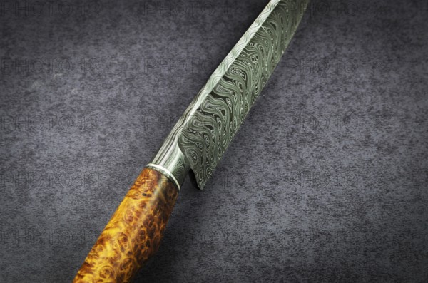 Beautiful luxurious utility knife in Texas Wind damask pattern with noble wood handle on dark
