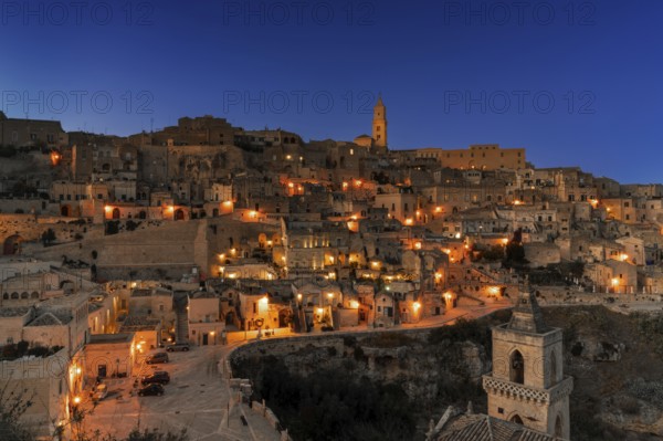 Matera, Italy, 26 November, 2023: view of the old town of Matera after sunset with the lights