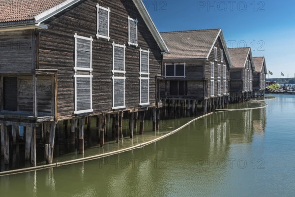 Hudiksvall, Halsingland, Gavleborg County -Sweden, 08 01 2019 Reflecting fishing warehouses in the