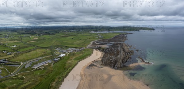An aerial view of Doughmore Bay and Beach with the Trump International Golf Club hotel and golf