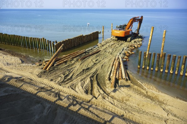 Construction equipment on the shore, the construction of breakwaters, coastal protection measures,
