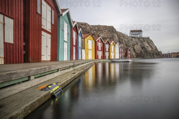 Small colourful houses by the sea. Typical houses in Sweden for the coastal landscape. Crab fishing