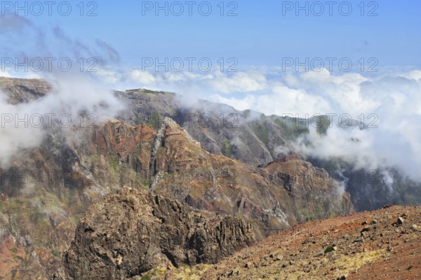 The highest peak of Madeira Island - Pico Ruyvu. By strong wind in the mountains of Madeira flying
