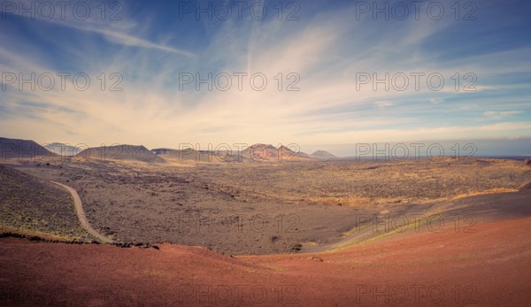 View on the desolate volcanic and moonlike landscape of Timanfaya National Park on Lanzarote, one