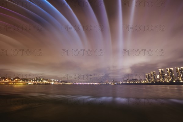 The famous Banpo Bridge is illuminated at night with water fountain display in Seoul, South Korea,
