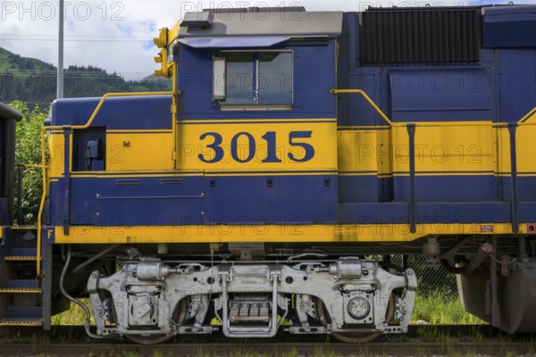 Close-up of a blue and yellow locomotive of the Alaska Railway with the number 3015, Alaska