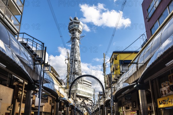 OSAKA, JAPAN - SEPTEMBER 26 2024: The famous Shinsekai area with Tsutenkaku Tower on a clear autumn
