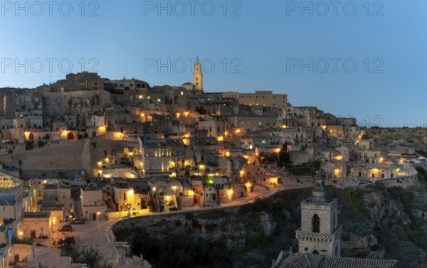Matera, Italy, 26 November, 2023: view of the old town of Matera after sunset with the lights