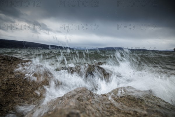 Stormy sea with powerful waves crashing against rocky shore, harbour, Mittelzell, Reichenau, Lake
