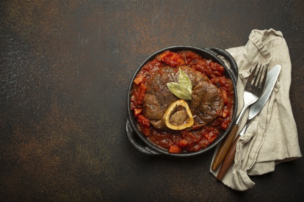 Traditional Italian dish Ossobuco all Milanese made with cut veal shank meat with vegetable tomato