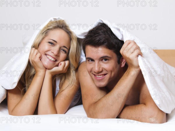 Couple has fun in bed. Laughter, joy and eroticism in the bedroom, Couple has fun in bed. Laughter,