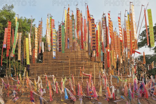 The flags and pennants adorn a special bamboo tower. Thai New Year - Songkran