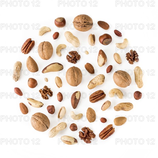 Pattern of nuts in circle form. Various nuts isolated on white. pecan, macadamia, brazil nut,