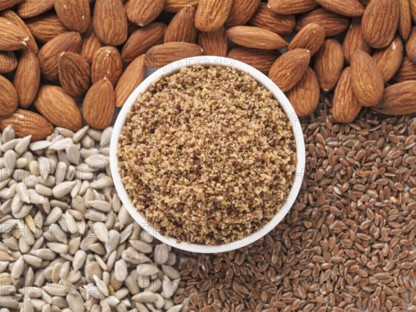 Homemade LSA mix in plate - Linseed or flax seeds, Sunflower seeds and Almonds. Traditional