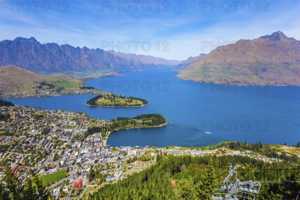 Huge azure lake among the mountains. Bird's eye view. Travel to New Zealand, South Island. The city