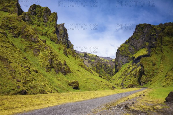 Canyon Pakgil - green grass and moss on fantastic rocks. On canyon there is dirt road. The summer