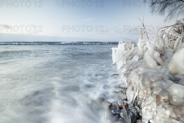 Frozen lake with waves and cloudy sky on a cold winter day, Hörnle, Constance, Lake Constance,
