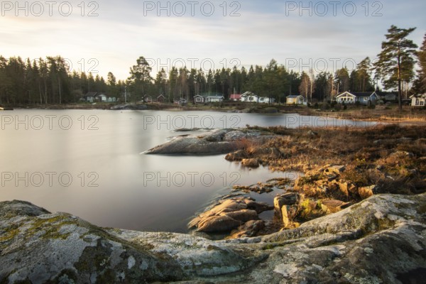 Shore of a lake at sunrise. Landscape shot in Narur in the morning. Forests, lake and water at the