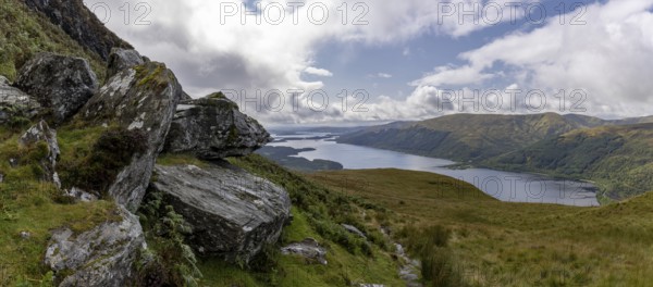 Rocks at the summit and views of Loch Lomond and the Loch Lomond and the Trossachs National Park