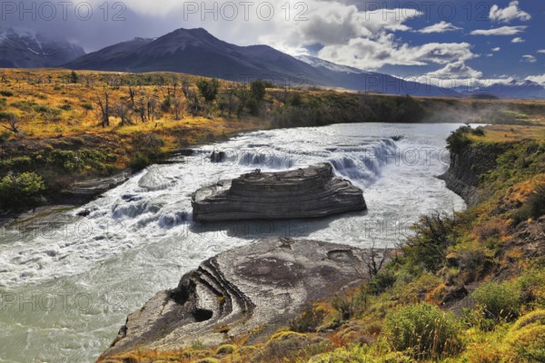 The majestic cascading waterfall - Cascades Paine. National Park Torres del Paine in southern