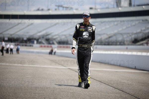 Grant Enfinger walks pit road before qualifying for the Clean Harbors 250 in Richmond, VA, USA,