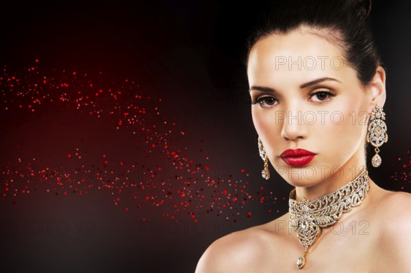 Beautiful woman with dark makeup and red lipstick posing on black background, Toronto, Canada,